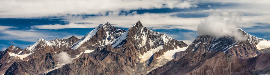 5120×1440 Resolution: Majestic Snowy Peaks Wallpaper