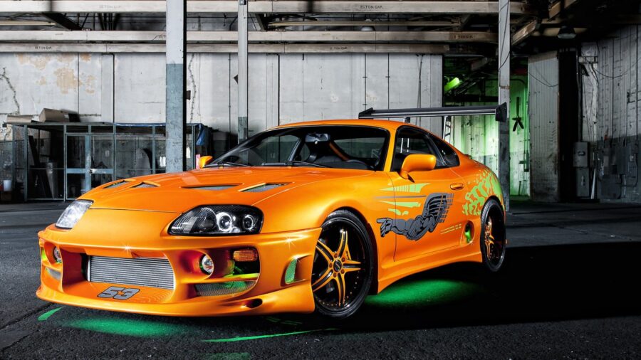 Fast and the Furious: Garage Parked Orange Sports Car Wallpaper