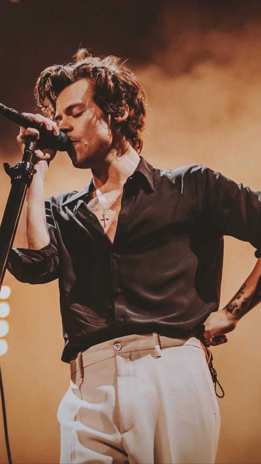 Harry Styles: Mesmerizing Melodies on Stage Wallpaper