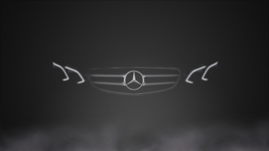 Mercedes: Embleem in Misty Glow Achtergrond